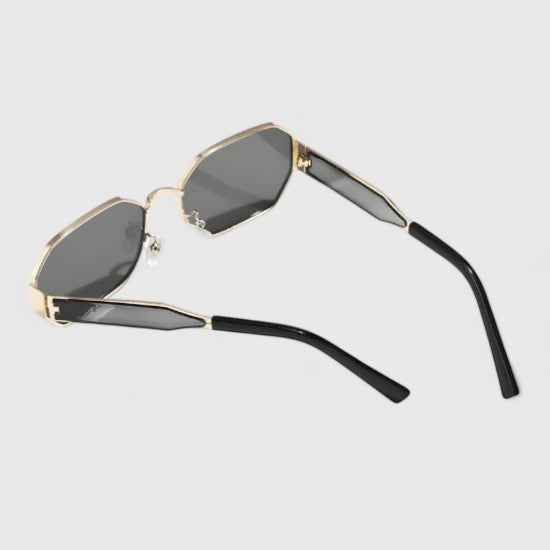 Jaylynne sunglasses with dark lenses and gold-tone frame, side view, black temples