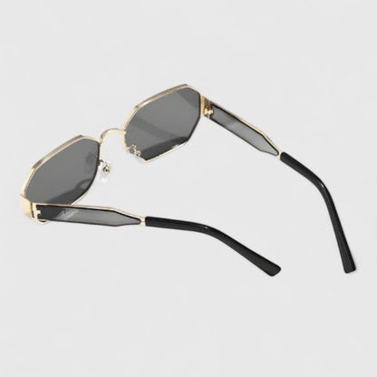 Jaylynne sunglasses with dark lenses and gold-tone frame, side view, black temples