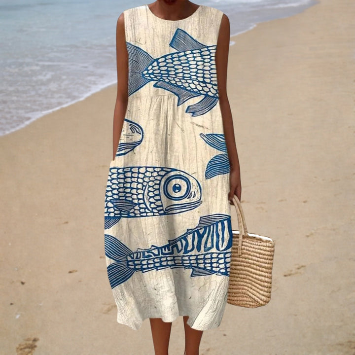 Sleeveless summer dress with cream base and blue fish print, round neck