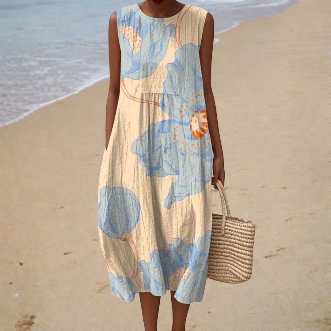 Sleeveless summer dress with scoop neck, cream base and blue floral abstract print, midi length