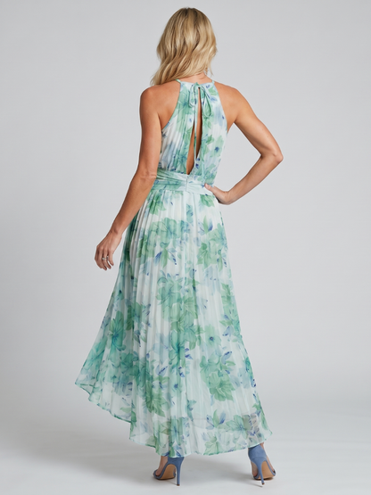 Green halter midi dress with open back and tied neck, pleated floral skirt