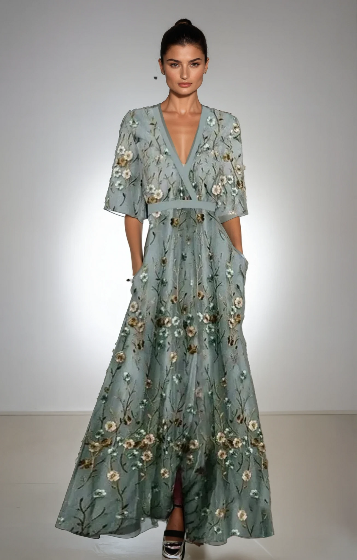 Floral maxi dress in dusty teal with small cream-gold blossoms, V-neck, short sleeves, tiered skirt