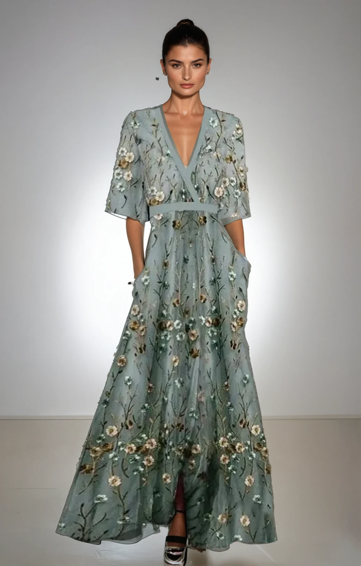 Floral maxi dress in dusty teal with small cream-gold blossoms, V-neck, short sleeves, tiered skirt