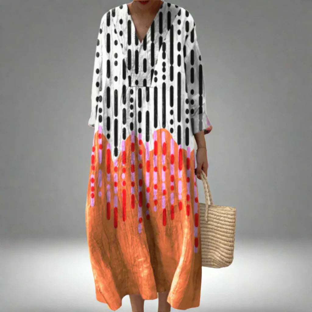 Geometric print midi dress with V-neck and long sleeves, black, white, and orange-red accents