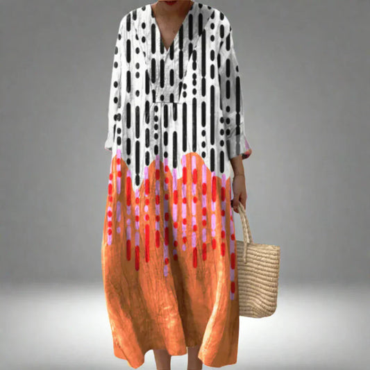 Geometric print midi dress with V-neck and long sleeves, black, white, and orange-red accents