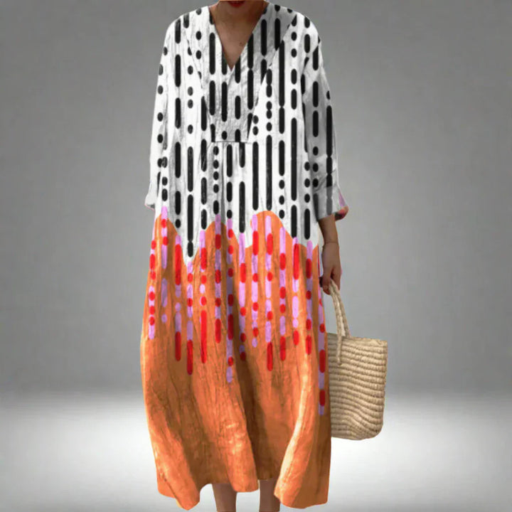 Geometric print midi dress with V-neck and long sleeves, black, white, and orange-red accents