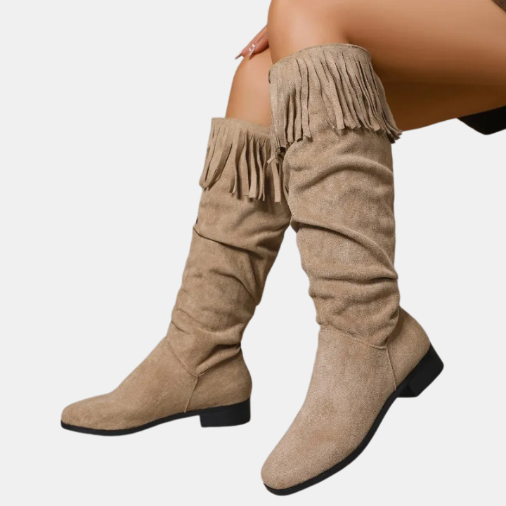 Khaki knee-high suede boots with fringed cuff and block heel.