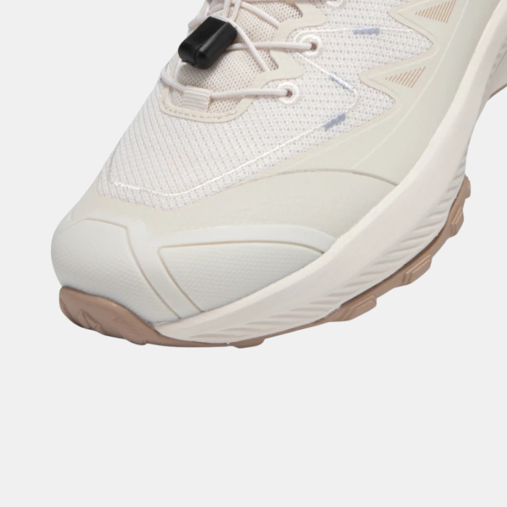 White breathable mesh sneakers with elastic buckle strap and lace-up front