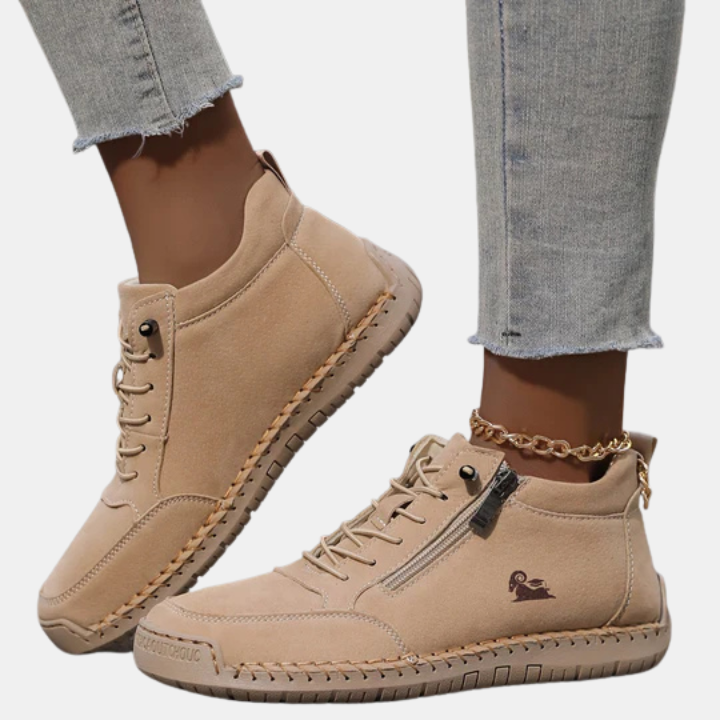 Light beige orthopedic lace-up shoes with side zipper, stitched sole, and padded collar