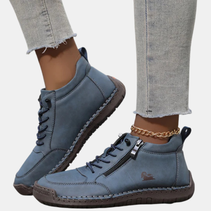 Blue orthopedic lace-up shoes with side zipper, chain ankle detail, and textured sole