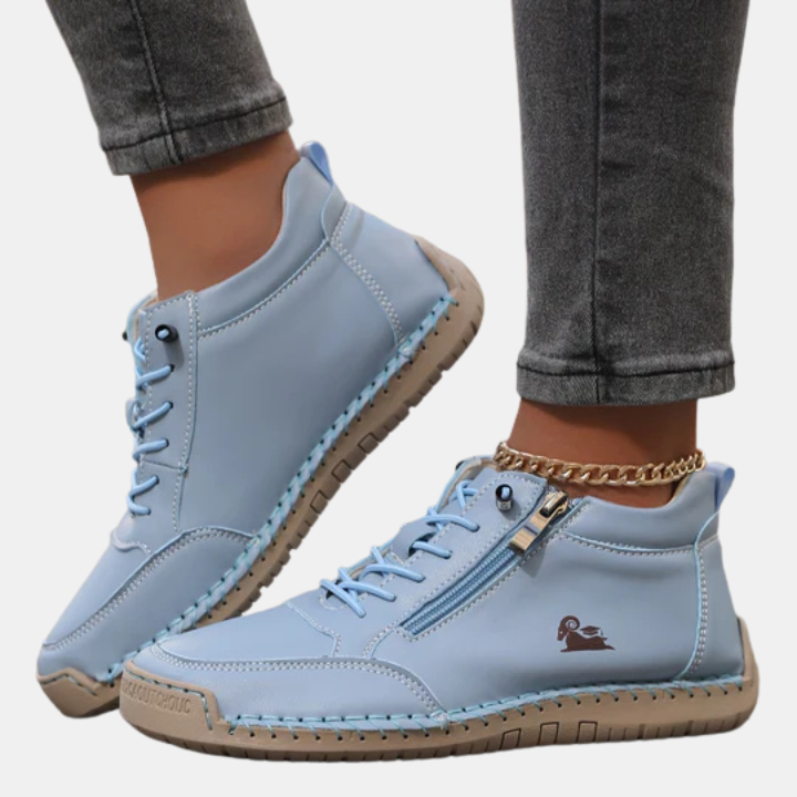 Light blue orthopedic lace-up shoes with side zipper, chain strap, and stitched outsole