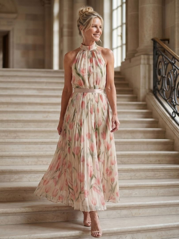 Halter neck floral midi dress with tulip print, pleated skirt, and satin belt