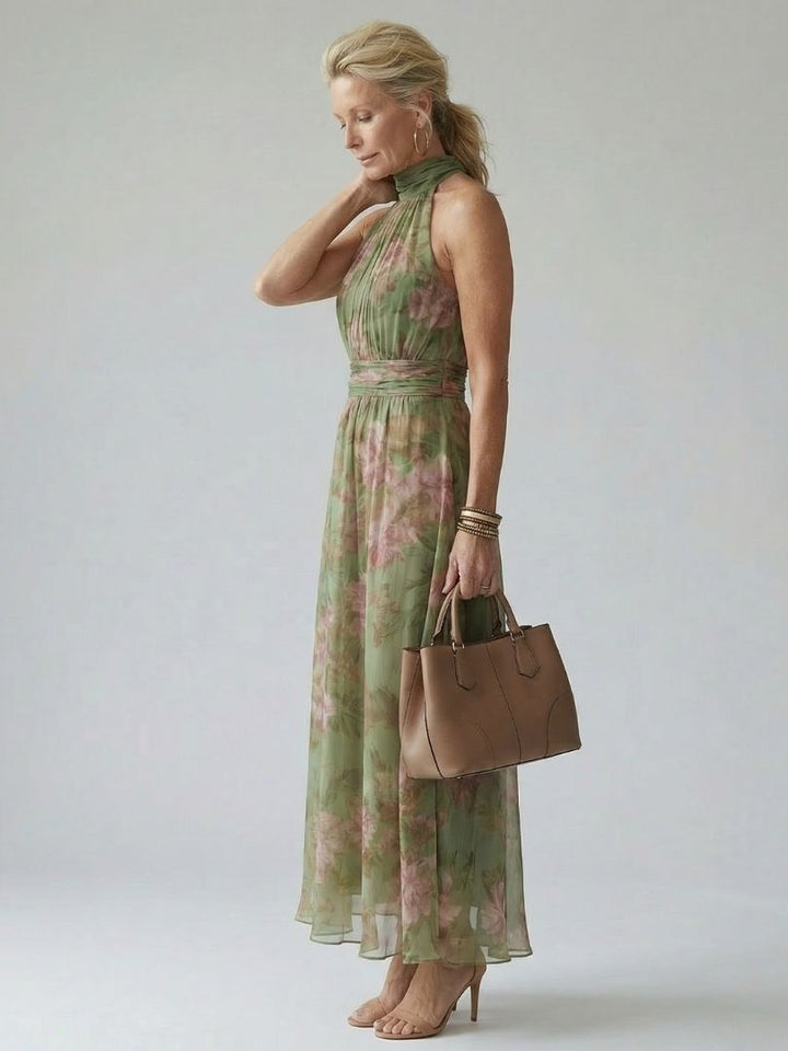 Sage green gathered halter midi dress with pink floral print, sleeveless high neck and flared skirt