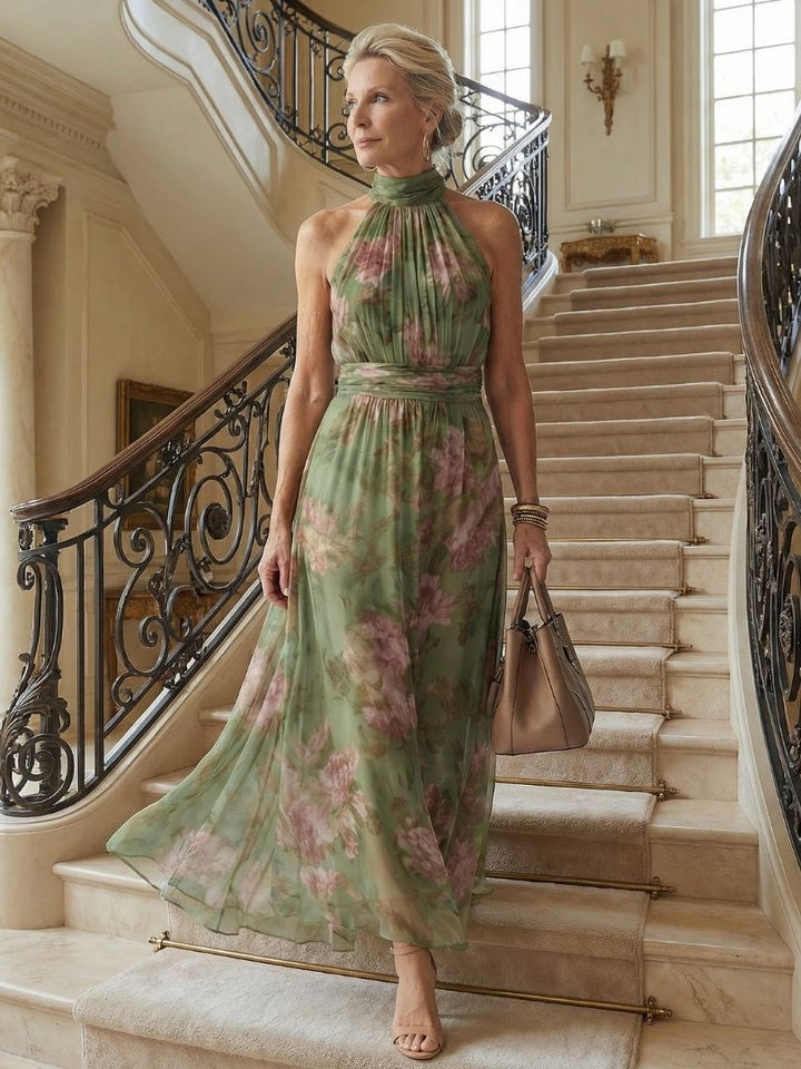 Sage green gathered halter midi dress with pink floral print, sleeveless high neck and tiered look