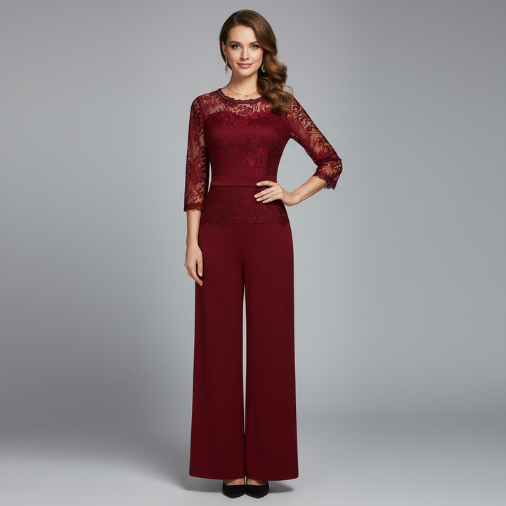 Red lace evening jumpsuit with 3/4 sleeves, round neckline, and wide-leg pants