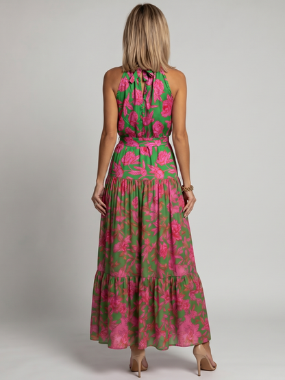 Floral halter midi dress back view with keyhole tie and tiered skirt, pink blooms on green.