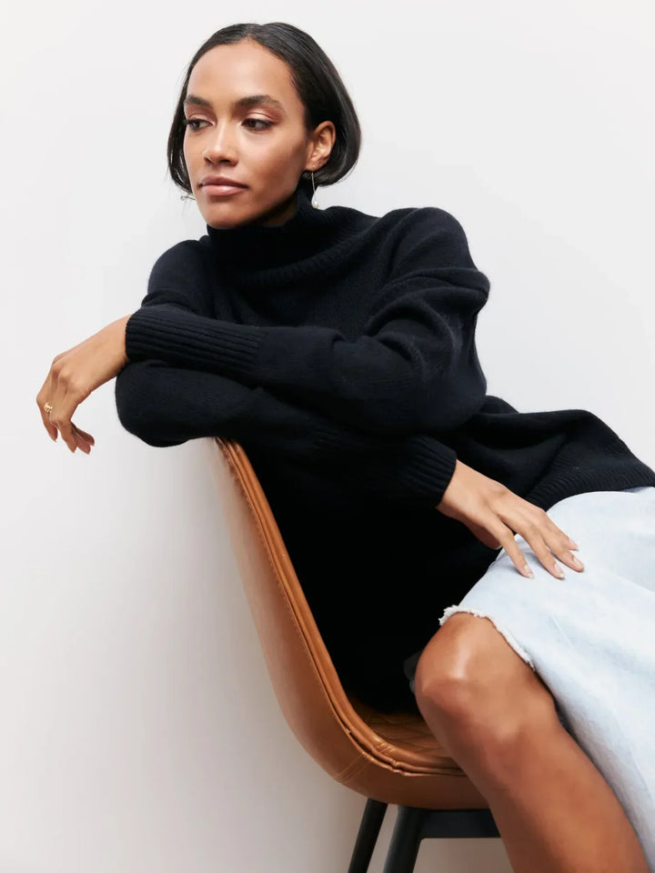 Black turtleneck sweater with wide ribbed collar and cuffs