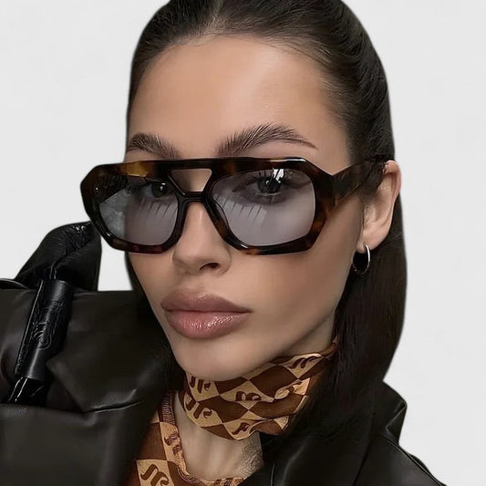 Oversized tortoiseshell sunglasses with dark lenses, wide rectangular frames