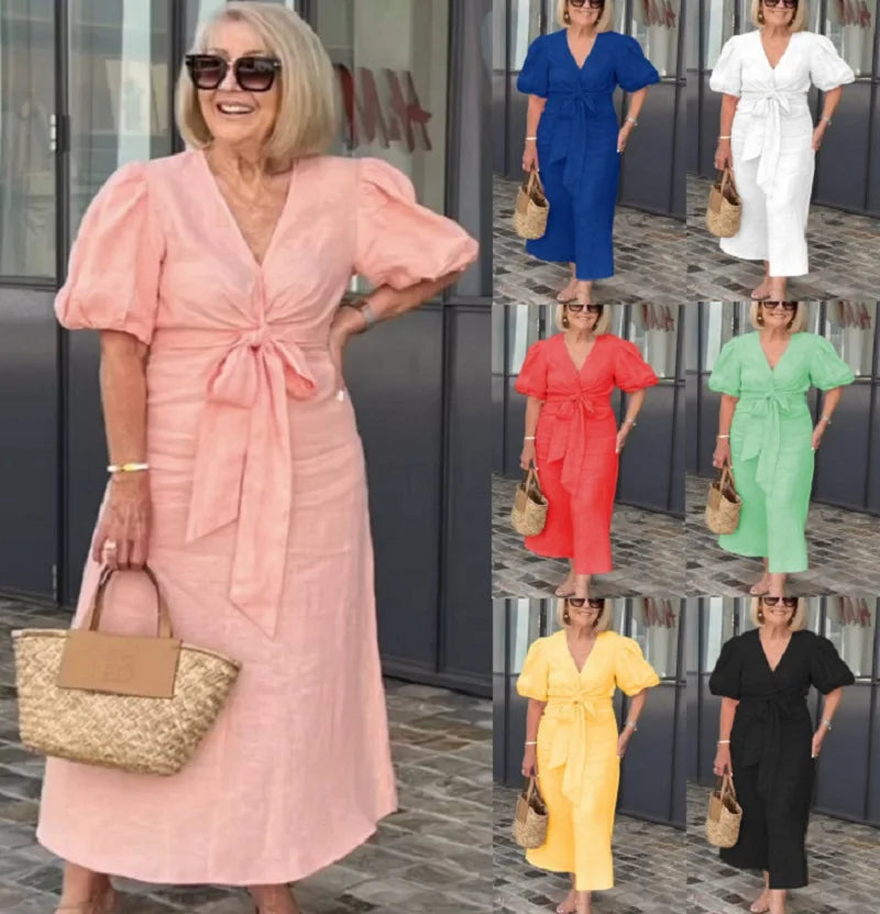 Peach V-neck midi dress with puff sleeves and waist tie, front view