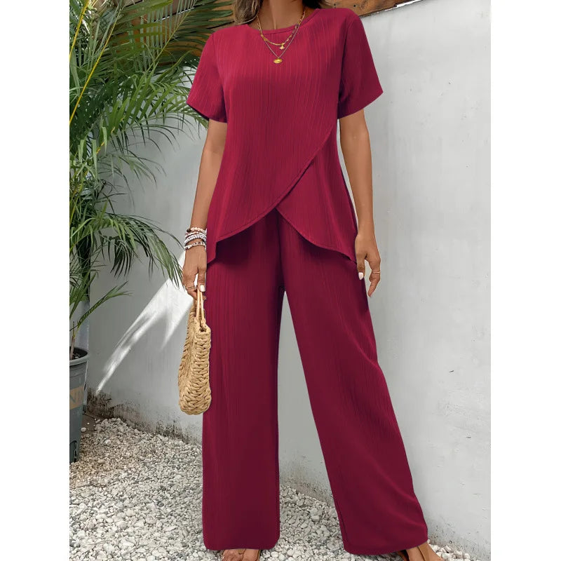 Red asymmetrical blouse and relaxed pants two-piece set, short sleeves