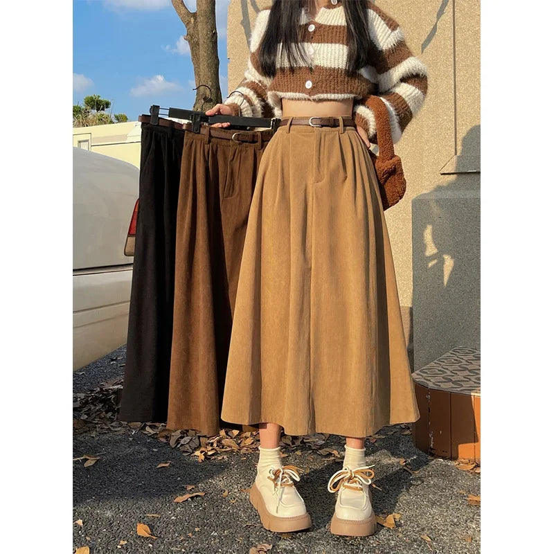 Tan corduroy midi skirt with wide belt, buttoned waistband pleats
