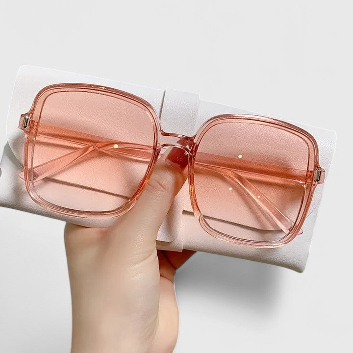 Rose square sunglasses with tinted pink lenses and metal hinges