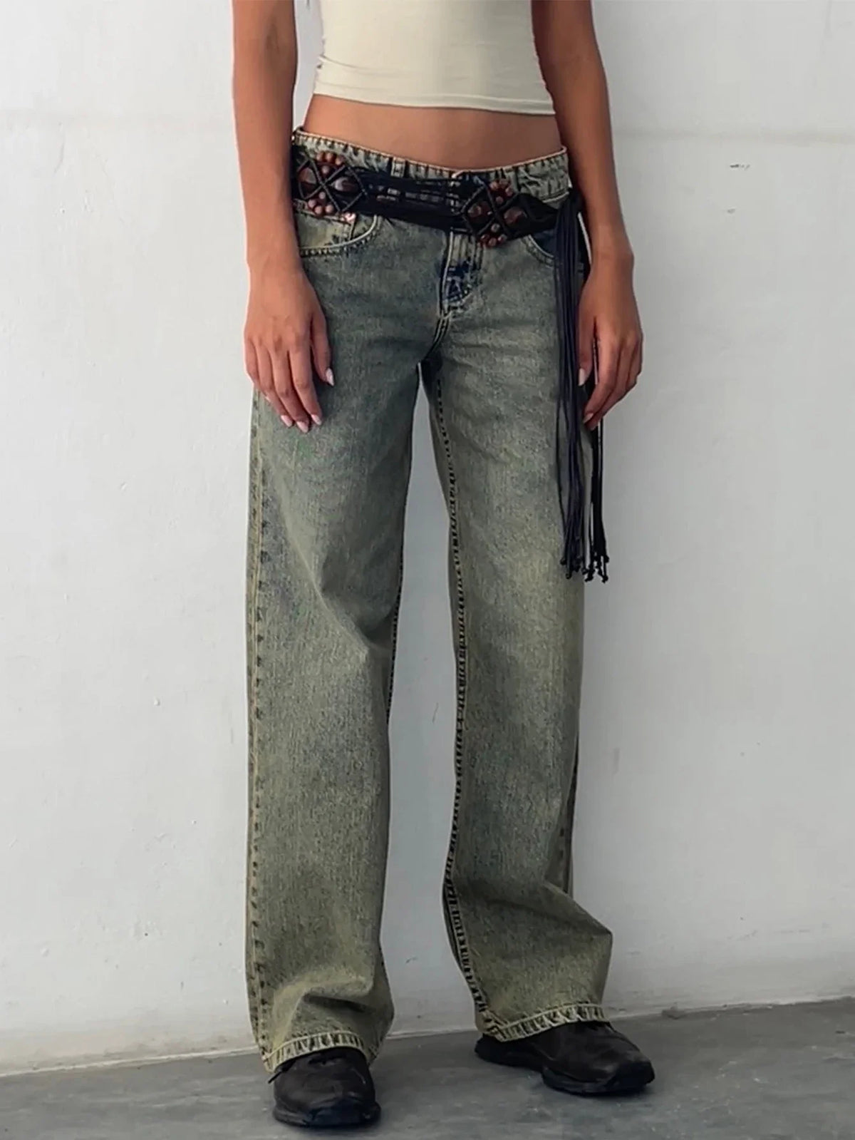 Olive-green washed baggy jeans with high-rise waist, button fly, and wide straight legs.