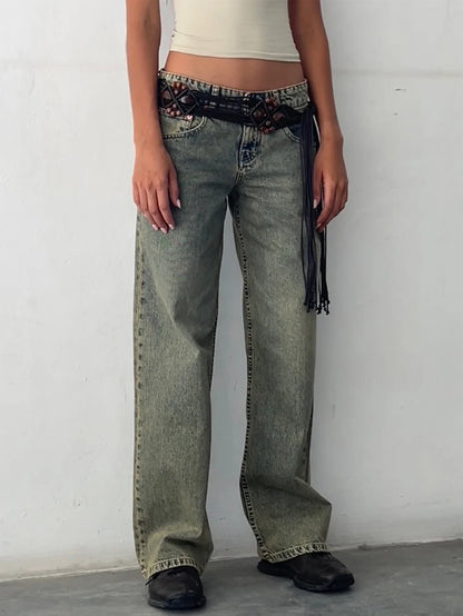 Olive-green washed baggy jeans with high-rise waist, button fly, and wide straight legs.