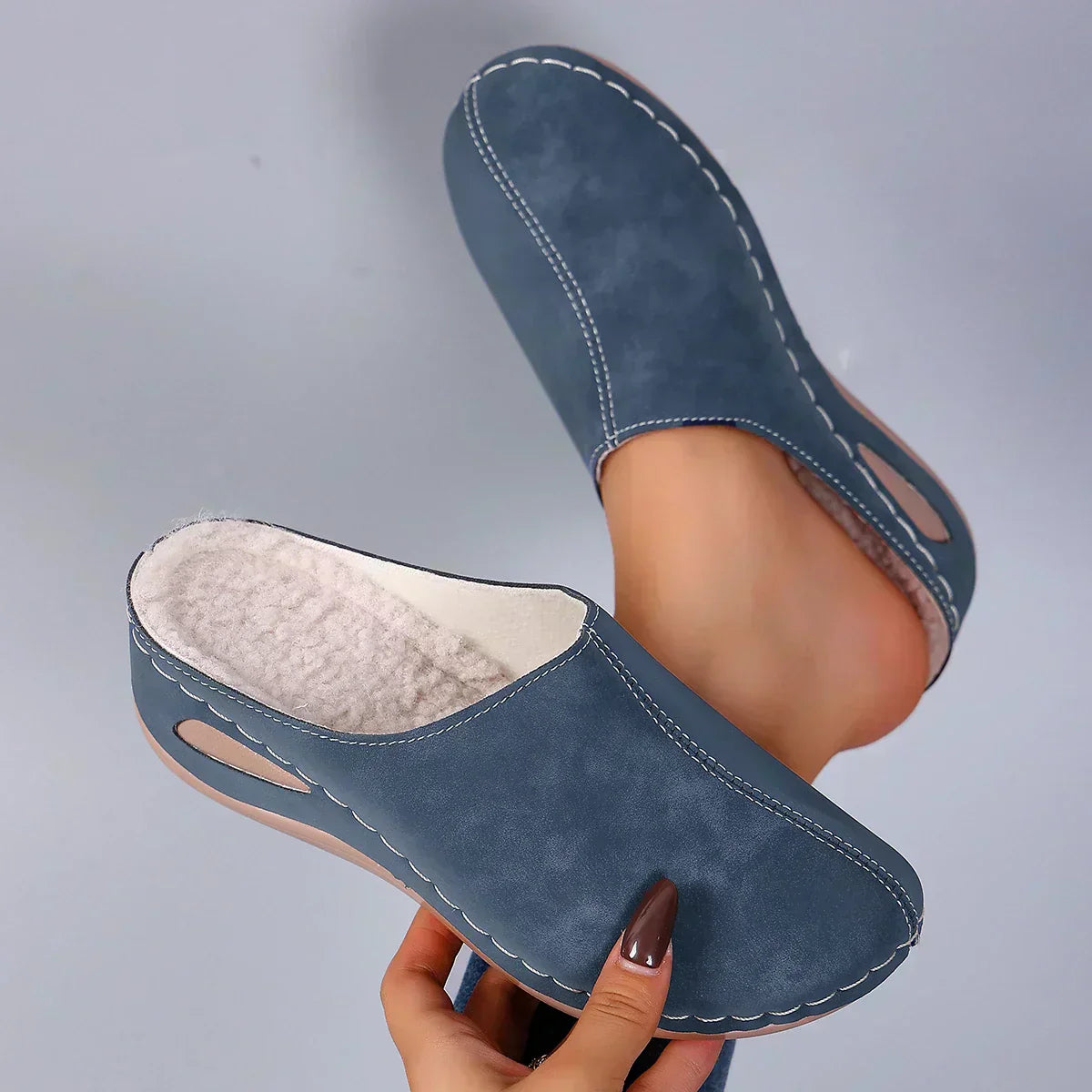 Blue orthopedic slip-on slippers with cushioned insole and stitched moc toe