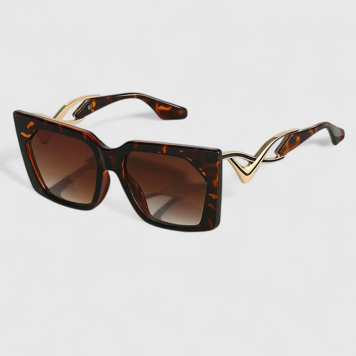 Cat-eye sunglasses with dark tortoise frame and brown gradient lenses
