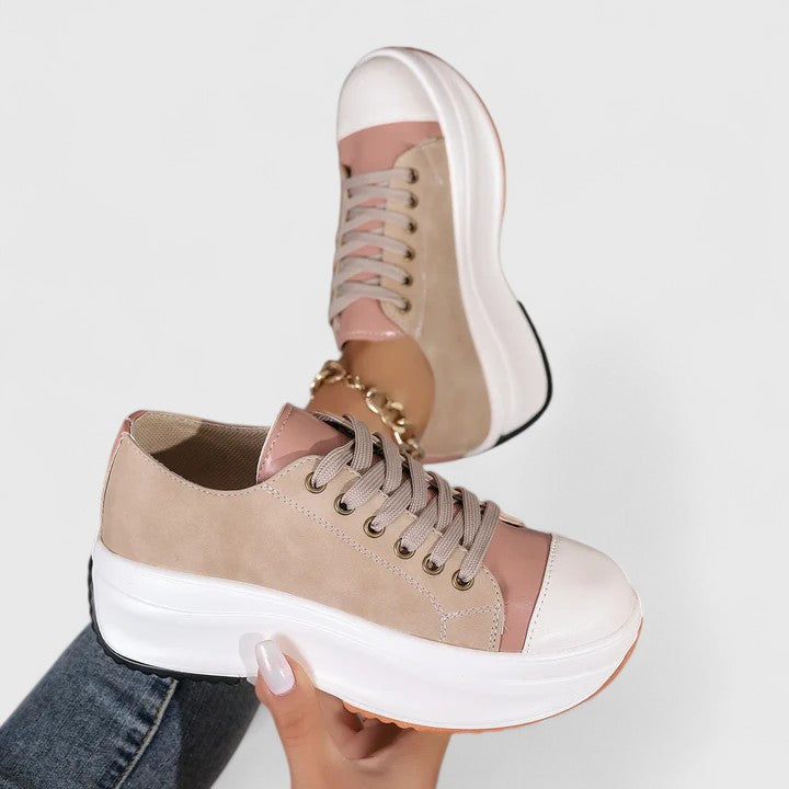 Khaki orthopedic sneaker with pink side inserts, lace-up eyelets, thick white sole