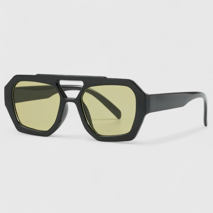 Black sunglasses with olive-green lenses and subtle yellow frame rim