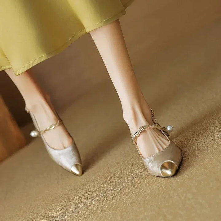 Beige metallic elegant pumps with open toe, slingback strap, pearl bead, and heel