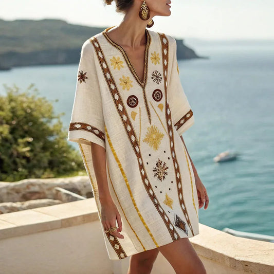 Vera beach dress with V-neck, short sleeves, yellow and brown patterned fabric