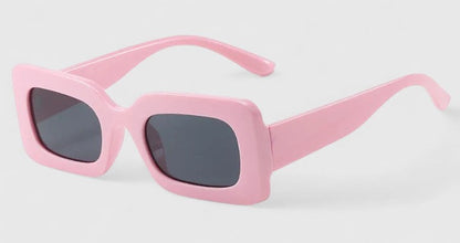 Elyanna sunglasses, light pink square frames with dark gray tinted lenses
