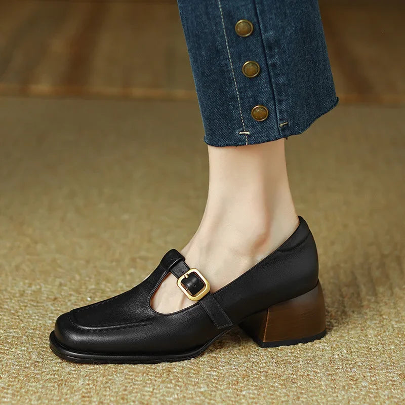 Black T-strap loafer with chunky heel and gold-tone buckle