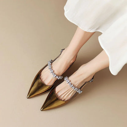 Gold metallic slingback pumps with rhinestone instep strap and pointed toe