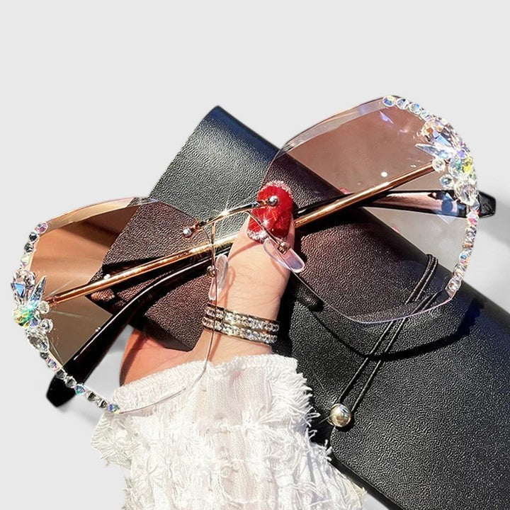 Jeweled sunglasses with gold-tone arms and dual-color gradient lenses