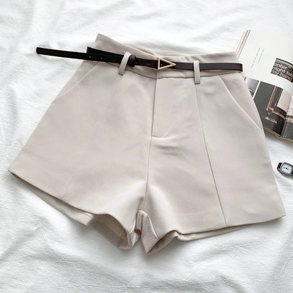 Ivory high-waist shorts with front crease and faux leather belt with gold buckle