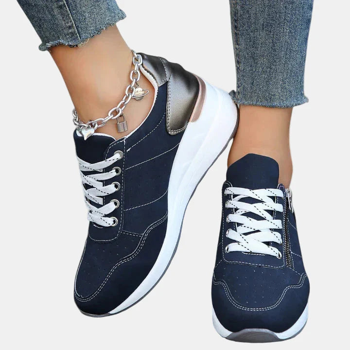 Orthopedic shoes in dark blue with white laces and silver chain ankle strap