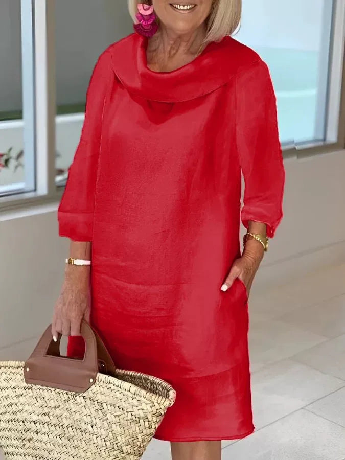 Red A-line dress with draped cowl neckline and three-quarter sleeves
