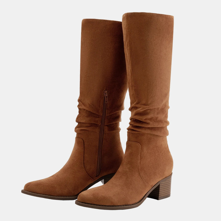 Dark tan suede knee-high boots with ruched shaft, side zip, and block heel