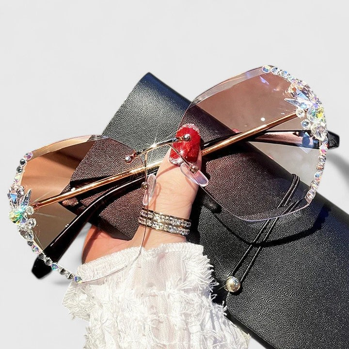 Jeweled sunglasses with gold-tone metal frame and soft brown gradient lenses