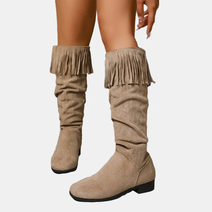 Khaki knee-high tassel boots on a block heel with suede finish.