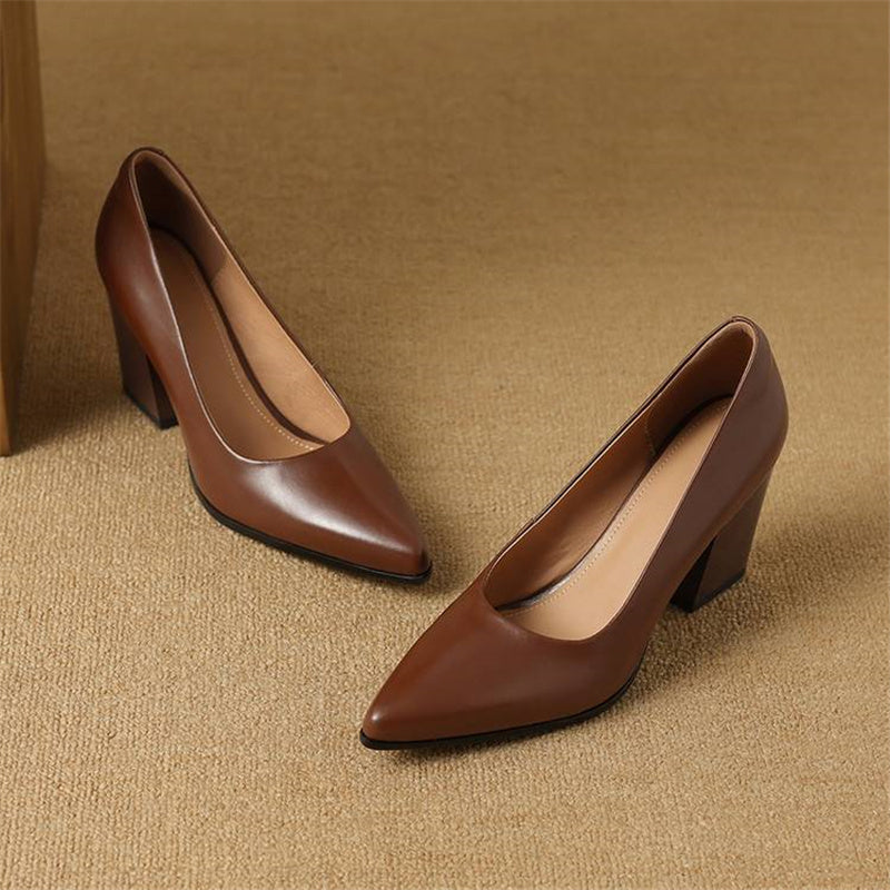 Brown leather pumps with almond toe and block heel, angled view