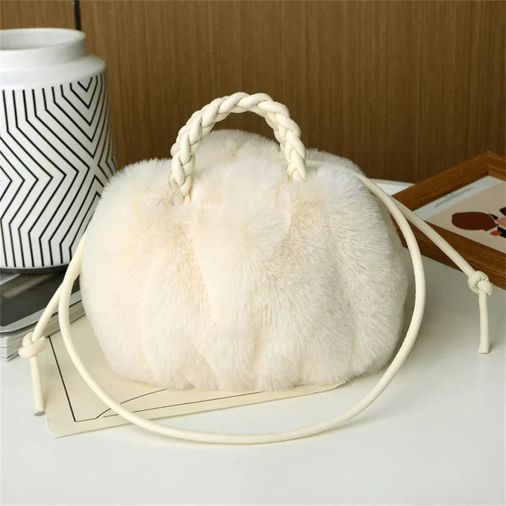 White plush pumpkin shoulder tote with braided handle and long rope strap