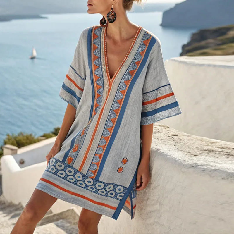 Flowy V-neck dress with short sleeves, gray base, blue-and-orange patterned trim