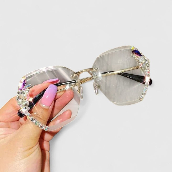 Jeweled sunglasses with gold-tone metal frame and clear gradient gray lenses