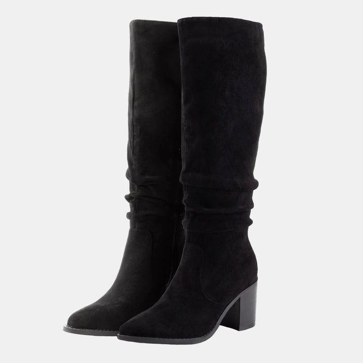 Black suede knee-high boots with ruched cuff, side zip, and block heel