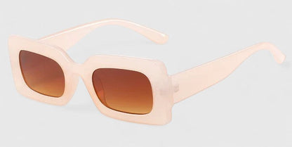 Light pink square sunglasses with amber lenses and thick frames